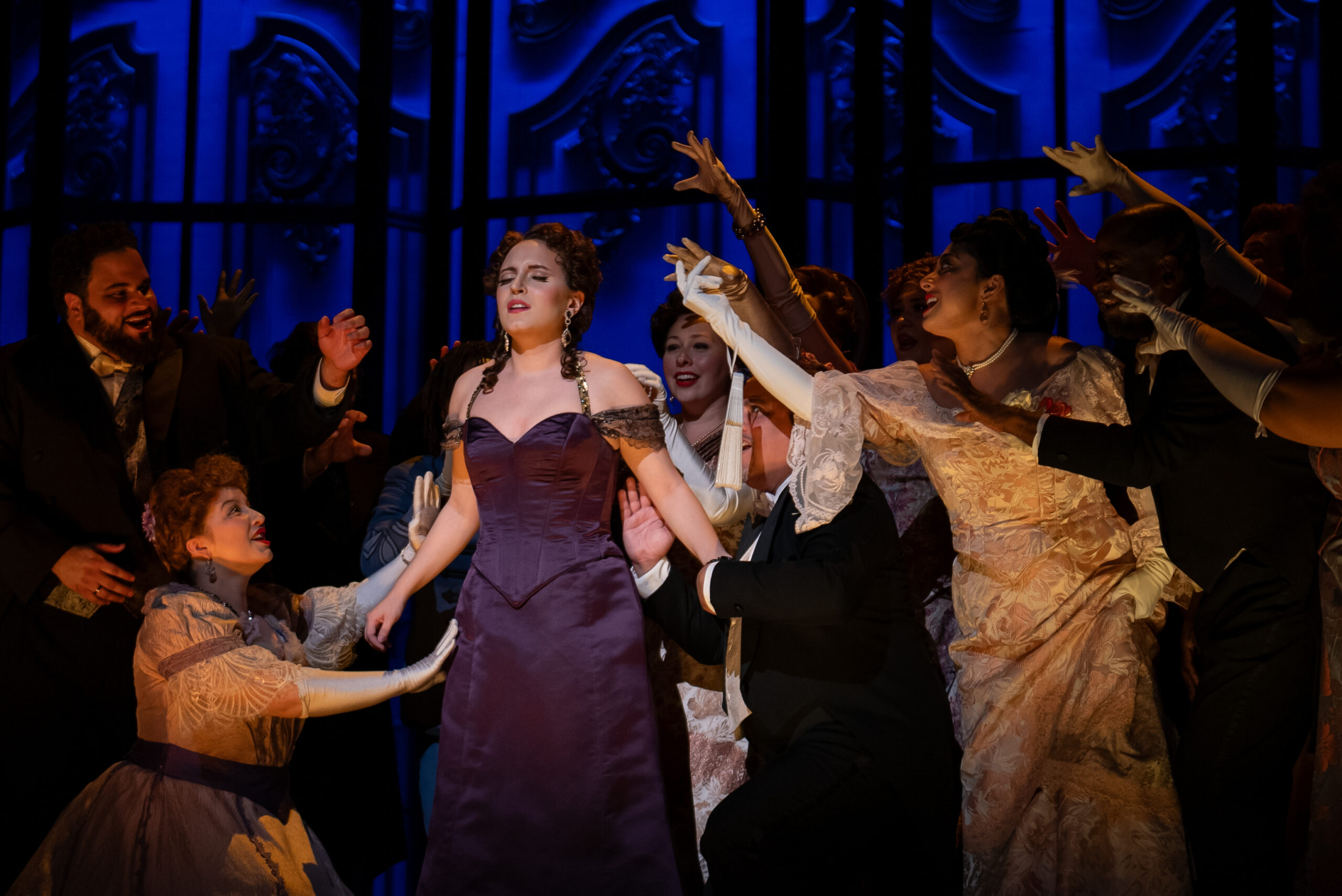 Soprano Emily Pogorelc as Violetta, with the Detroit Opera Chorus, in Verdi’s La traviata at Detroit Opera, directed by Francesca Zambello and conducted by Roberto Kalb, October 19, 25, and 27 2024. Photo by Austin Richey / Detroit Opera